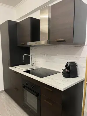 a kitchen with a sink and a counter top at Loft Villa Blanc in Rome