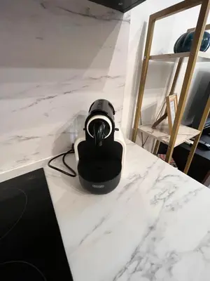 a camera sitting on a white marble counter at Loft Villa Blanc in Rome