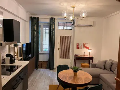 a living room with a couch and a table at Loft Villa Blanc in Rome