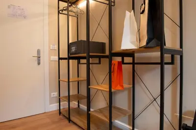 a room with wooden shelves and a door at Hotel AD Suites Nazionale in Rome