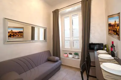 a living room with a couch and a sink at Popolo Pen 3 Apartament in Rome