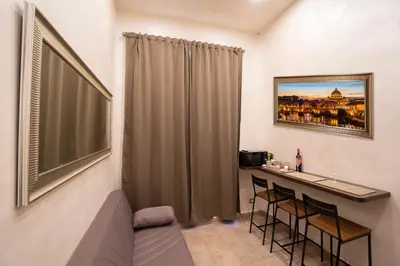 a small room with a table and two chairs at Popolo Pen 3 Apartament in Rome
