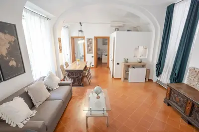 a living room with a couch and a table at Home d'Elite Trevi Fountain in Rome