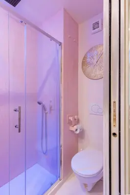 a bathroom with a shower and a toilet at The 62 Home l Homkeey Apartments in Rome