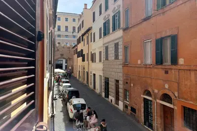 a view of a city street with cars and people at Borgo Comfortable Loft in Rome