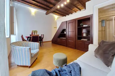 a living room with a couch and a table at Borgo Comfortable Loft in Rome