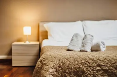 a hotel room with a bed with two towels on it at Monferrato Home in Rome