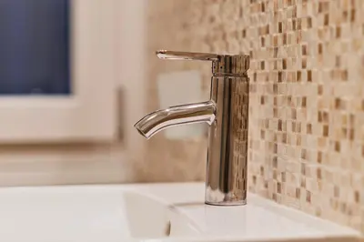 a bathroom sink with a faucet on a counter at Monferrato Home in Rome